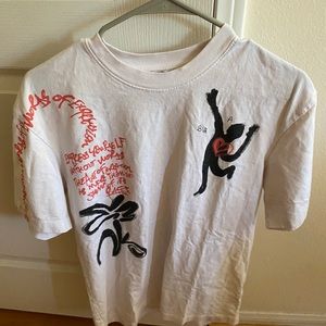 Zara White and Black with orange writing.